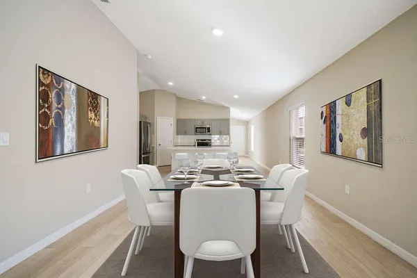 a dining room with furniture and window