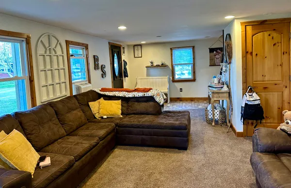 a kitchen with stainless steel appliances granite countertop a refrigerator stove top oven and sink