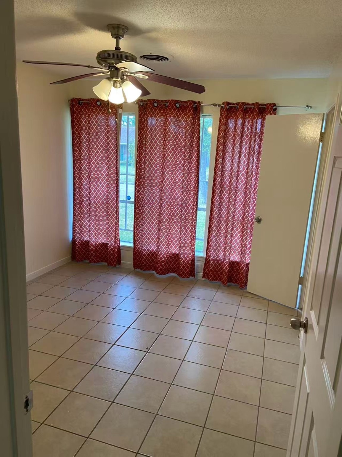 8911 Mobud Drive Houston, TX 77036 - Photo 6 of 8 a view of a room with wooden floor and windows
