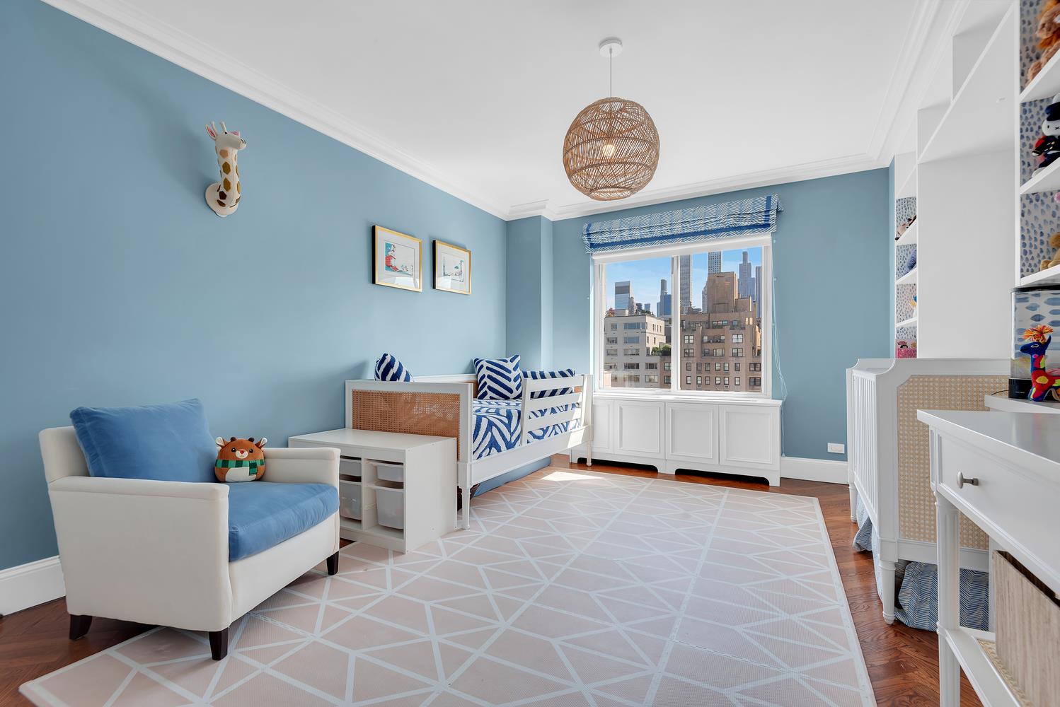 3 East 71st Street, Unit 10/11B Manhattan, NY 10021 - Photo 12 of 17 a living room with furniture and a window