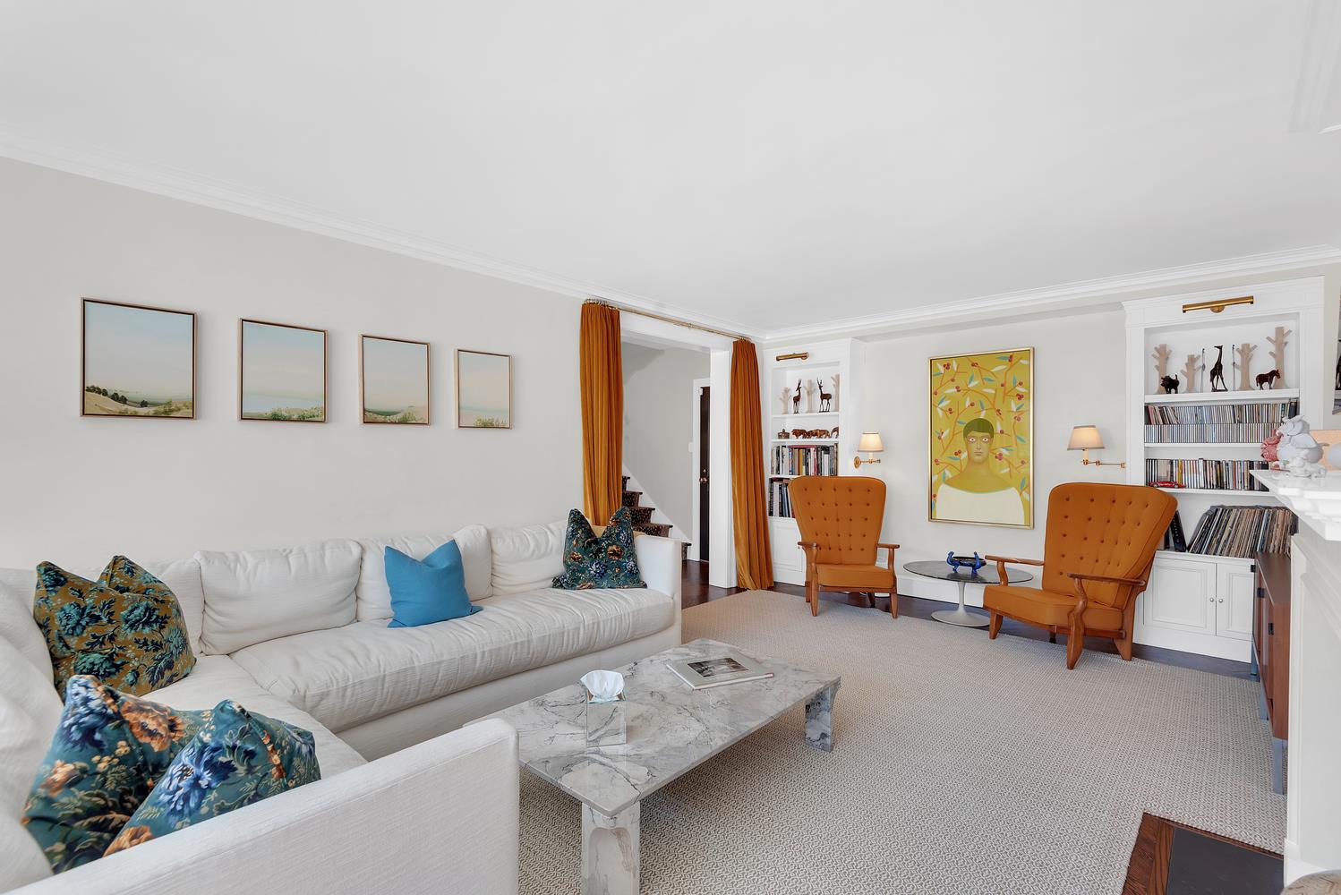 3 East 71st Street, Unit 10/11B Manhattan, NY 10021 - Photo 4 of 17 a living room with furniture and a large window