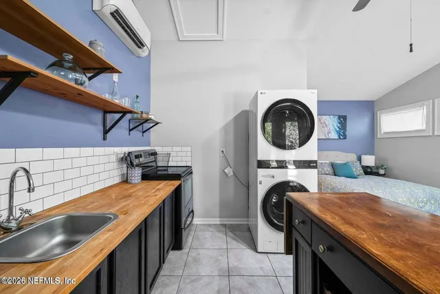 a kitchen with stainless steel appliances granite countertop a sink and a stove