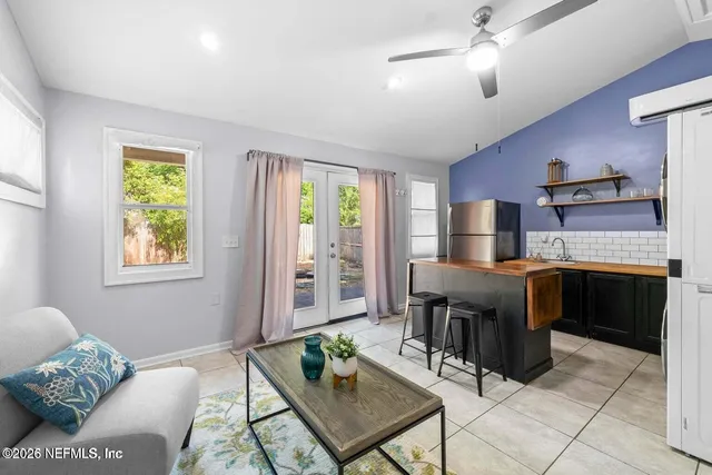 a living room with furniture and a window
