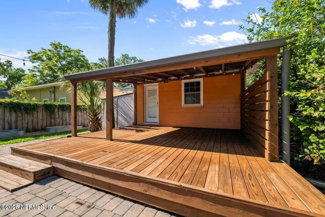 a view of backyard with a patio
