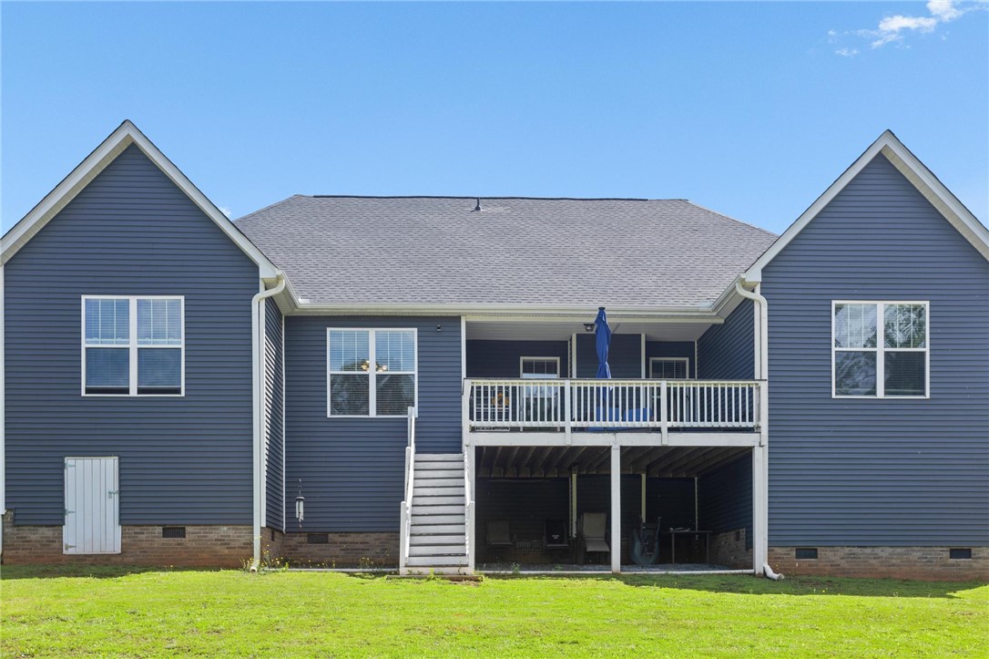 125 Estateside Drive Anderson, SC 29621 - Photo 36 of 37 Backyard retreat featuring a broad deck and ample space for outdoor enjoyment.