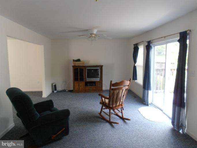 3065 Cox Road Chesapeake Beach, MD 20732 - Photo 2 of 17 a living room with furniture and a fireplace