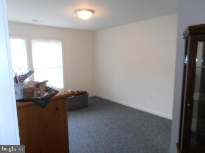3065 Cox Road Chesapeake Beach, MD 20732 - Photo 11 of 17 a view of empty room with windows