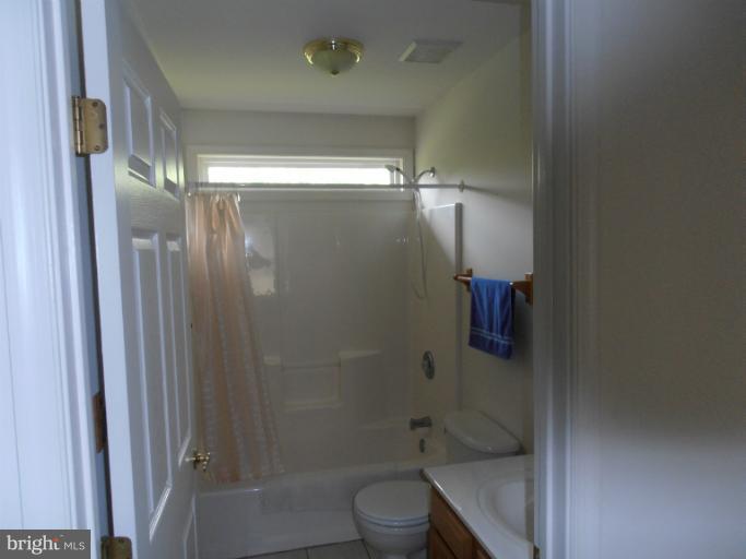3065 Cox Road Chesapeake Beach, MD 20732 - Photo 14 of 17 a bathroom with a shower a toilet and sink
