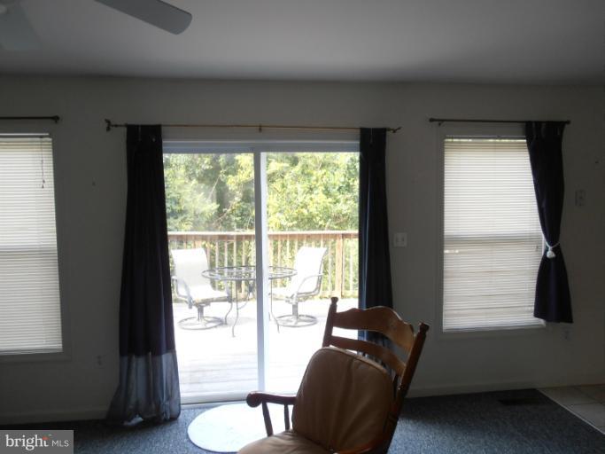 3065 Cox Road Chesapeake Beach, MD 20732 - Photo 3 of 17 a living room with furniture and a floor to ceiling window