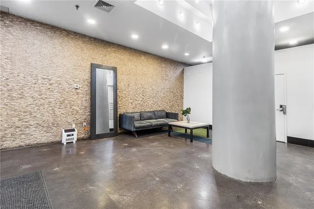 a view of game room with windows