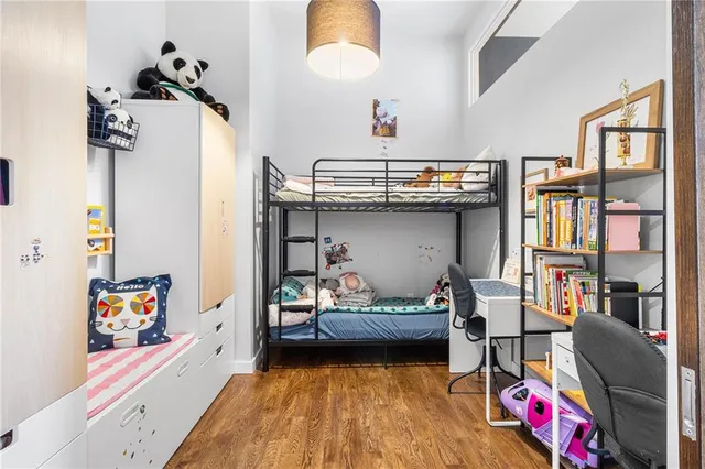 a bedroom with furniture and a book shelf