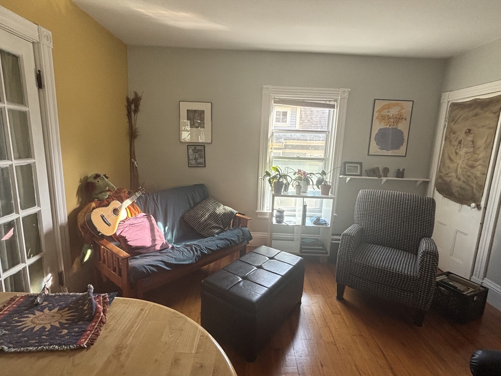 21 Conway Street, Unit 2 Boston, MA 02131 - Photo 3 of 12 a living room with furniture and wooden floor