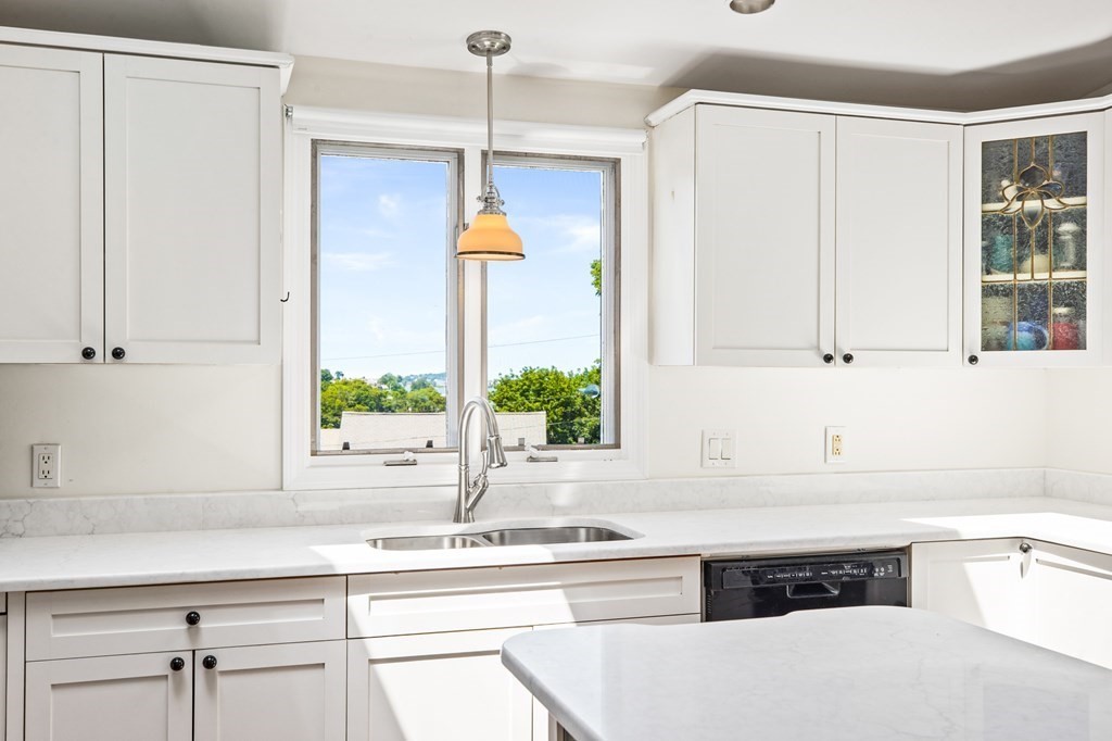 29 Governor Long Road Hingham, MA 02043 - Photo 12 of 39 a kitchen with a sink and cabinets