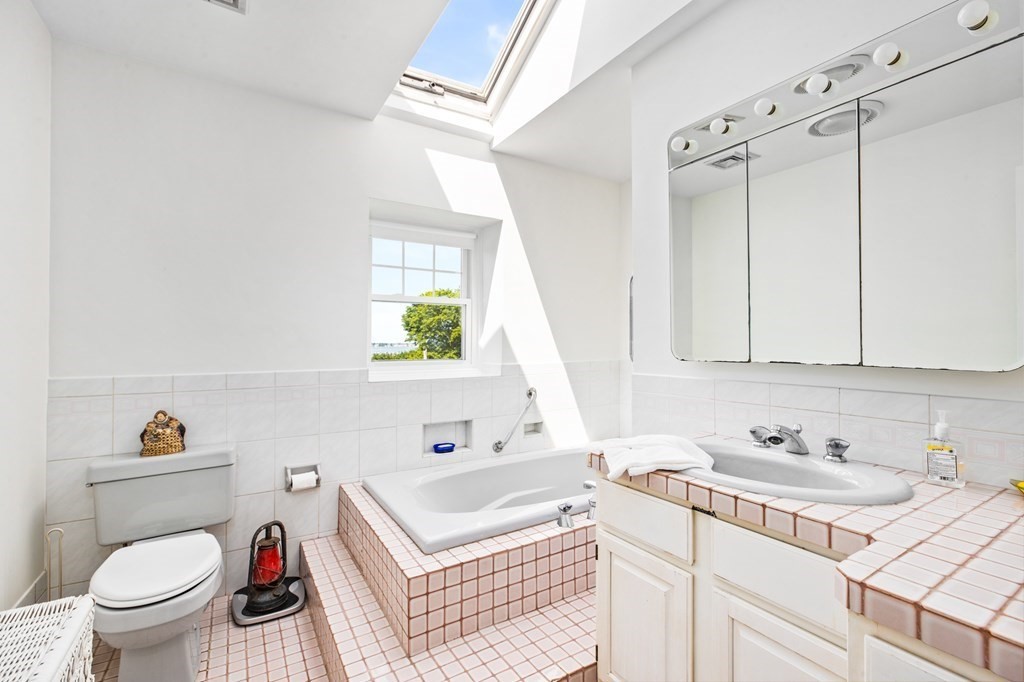 29 Governor Long Road Hingham, MA 02043 - Photo 30 of 39 a bathroom with a sink a toilet and a window