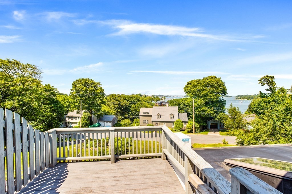 29 Governor Long Road Hingham, MA 02043 - Photo 31 of 39 a view of a balcony with wooden floor and fence