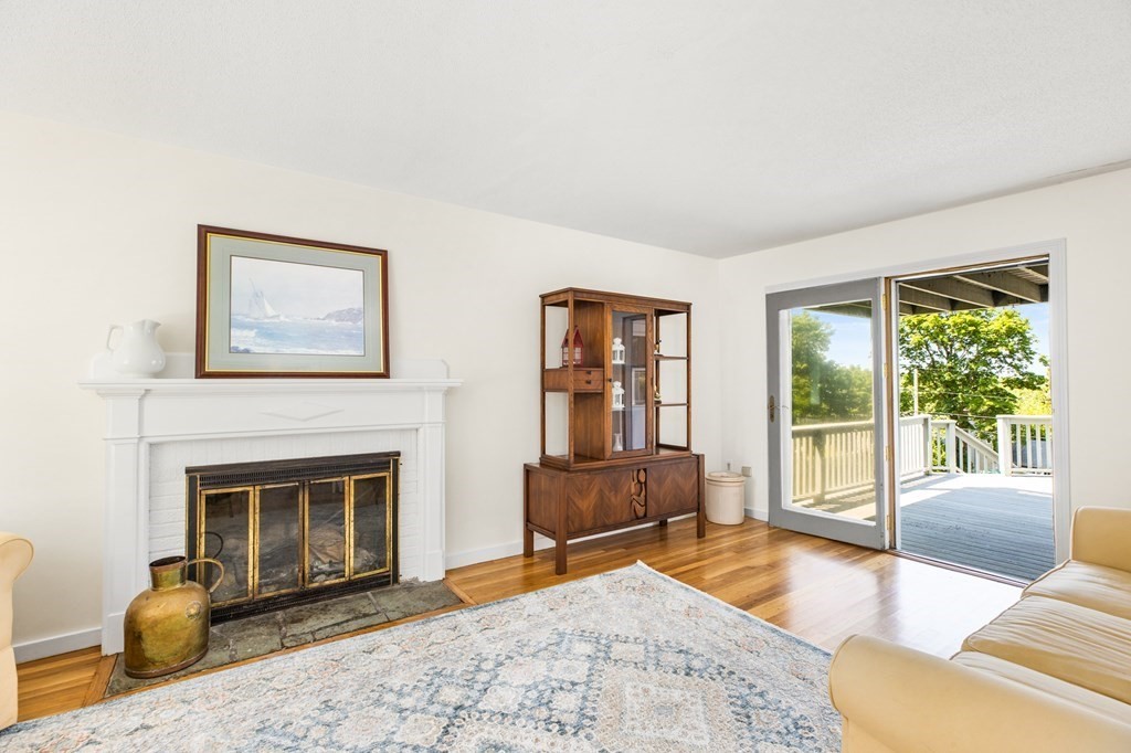 29 Governor Long Road Hingham, MA 02043 - Photo 5 of 39 a living room with furniture and a fireplace