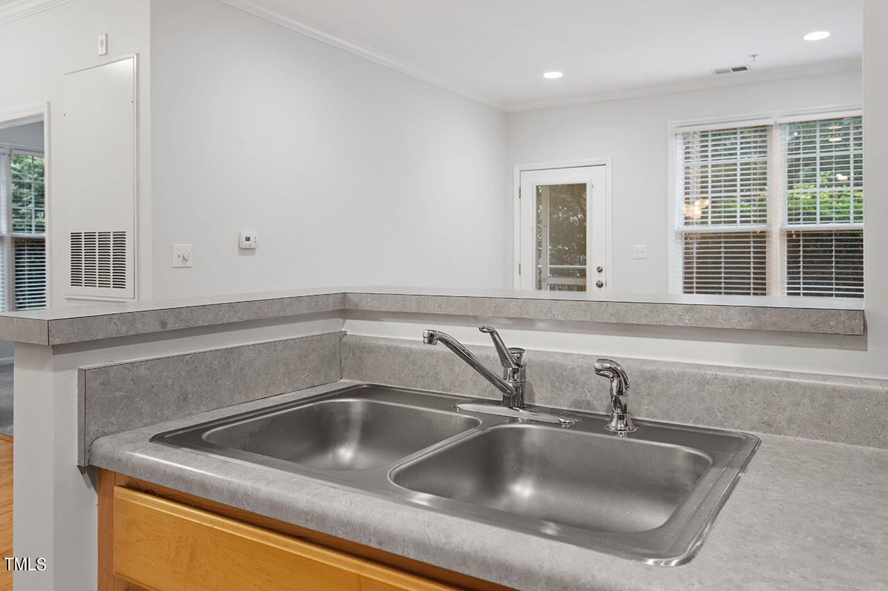 800 Moratuck Drive, Unit 102 Raleigh, NC 27604 - Photo 15 of 36 a close view of sink and tap