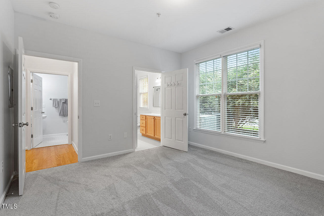 800 Moratuck Drive, Unit 102 Raleigh, NC 27604 - Photo 21 of 36 a view of an empty room with a window