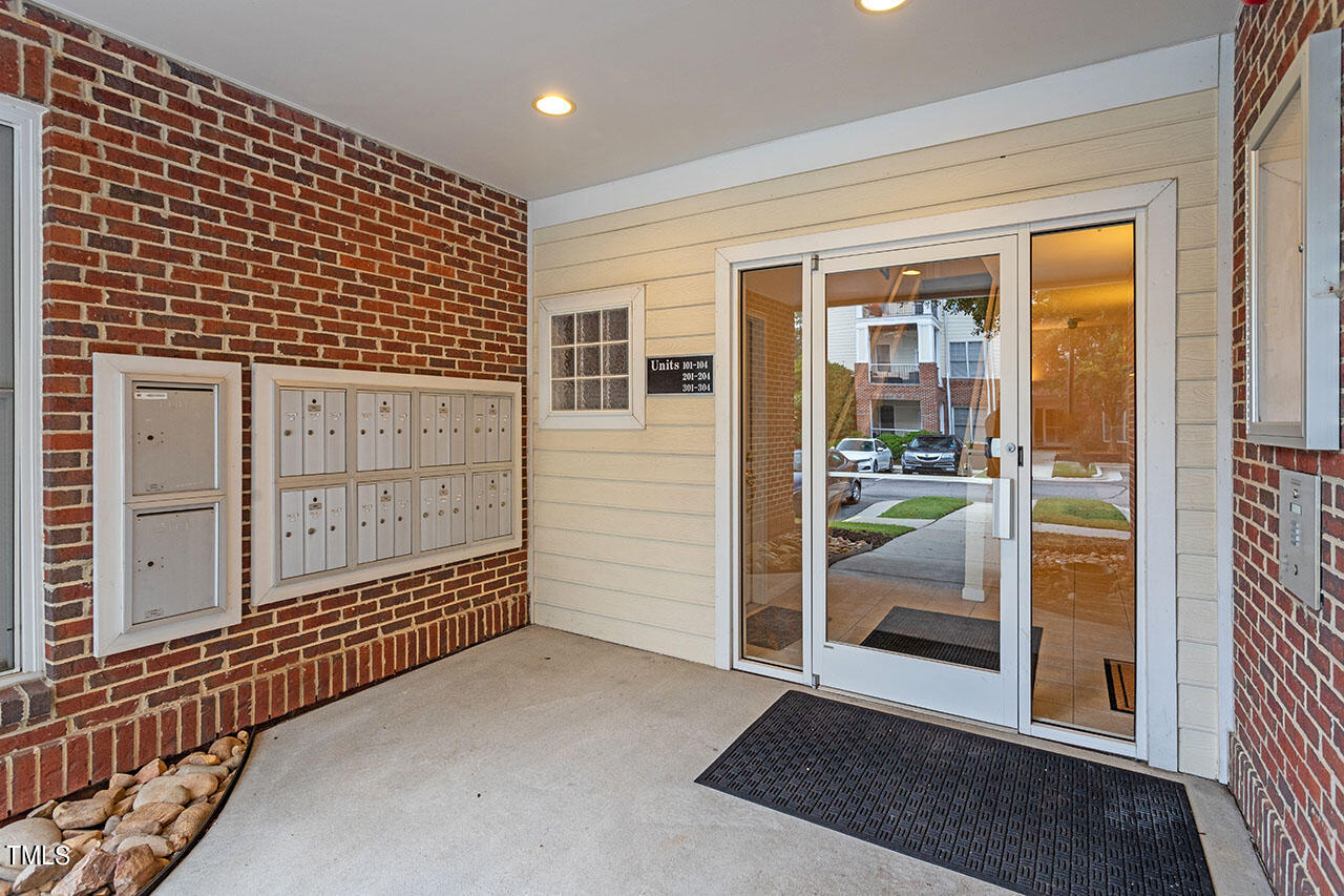 800 Moratuck Drive, Unit 102 Raleigh, NC 27604 - Photo 3 of 36 a view of a porch with a door
