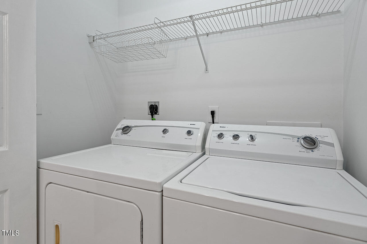 800 Moratuck Drive, Unit 102 Raleigh, NC 27604 - Photo 31 of 36 a utility room with dryer and washer