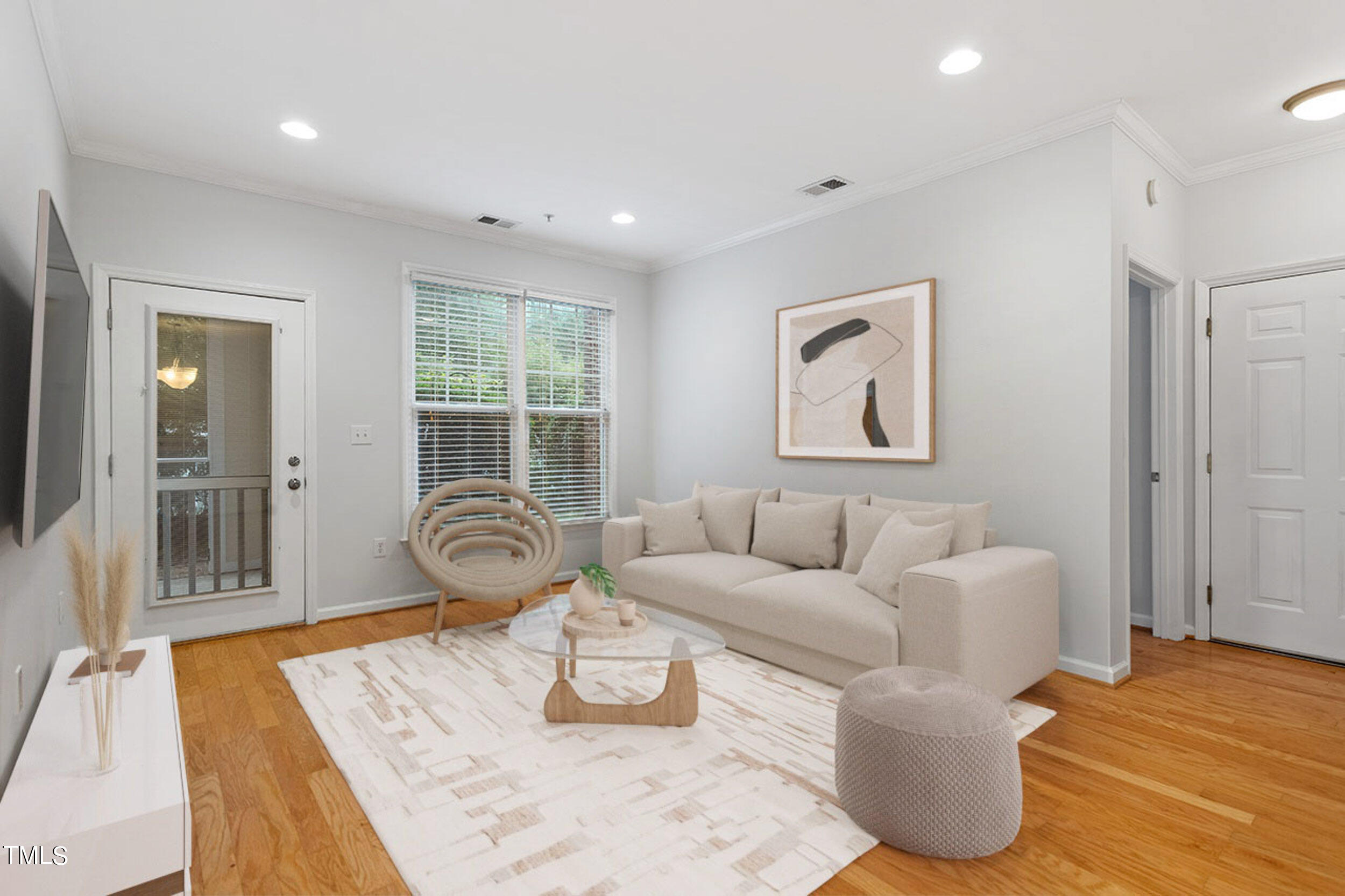 800 Moratuck Drive, Unit 102 Raleigh, NC 27604 - Photo 9 of 36 a living room with furniture and wooden floor
