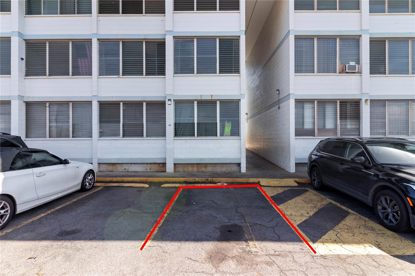 94-249 Waikele Road, Unit A307 Waipahu, HI 96797 - Photo 14 of 20 a front view of a building with parking space