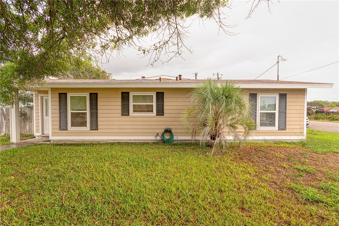 1202 Crosby Street Portland, TX 78374 - Photo 1 of 20 a front view of a house with yard