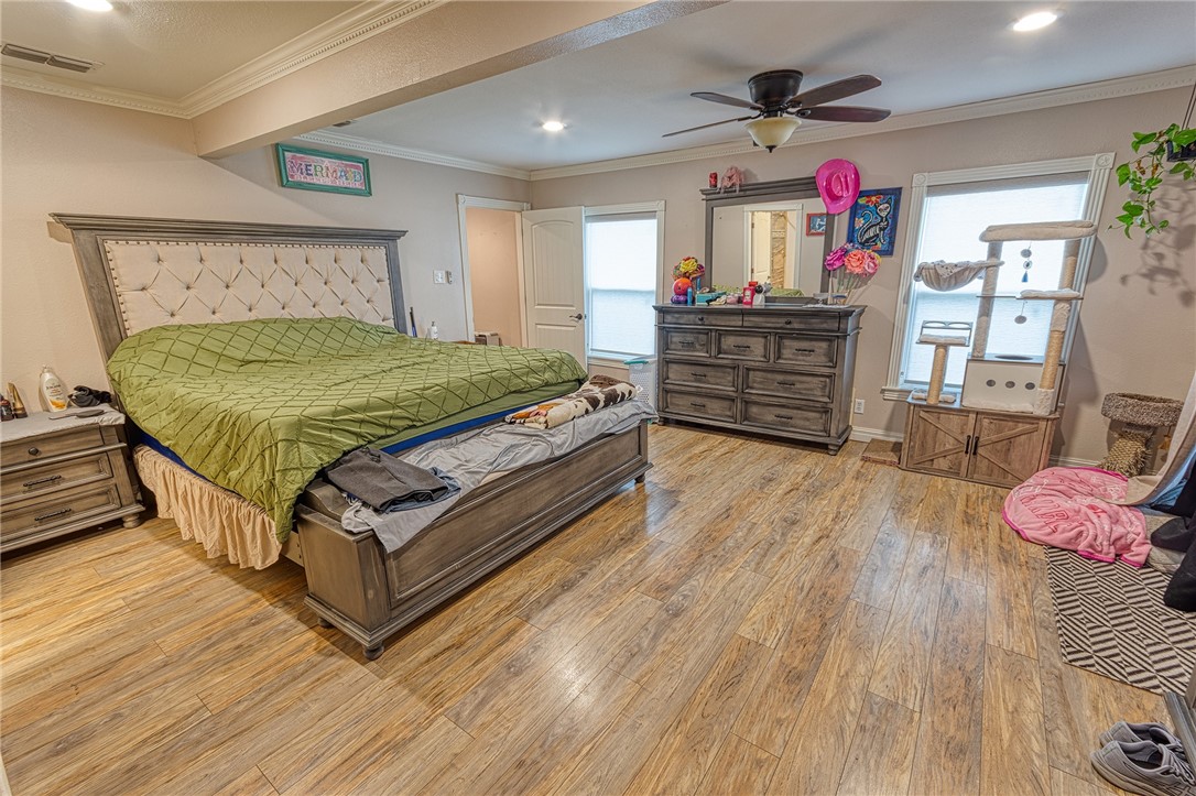 1202 Crosby Street Portland, TX 78374 - Photo 12 of 20 a bed room with a bed and a television