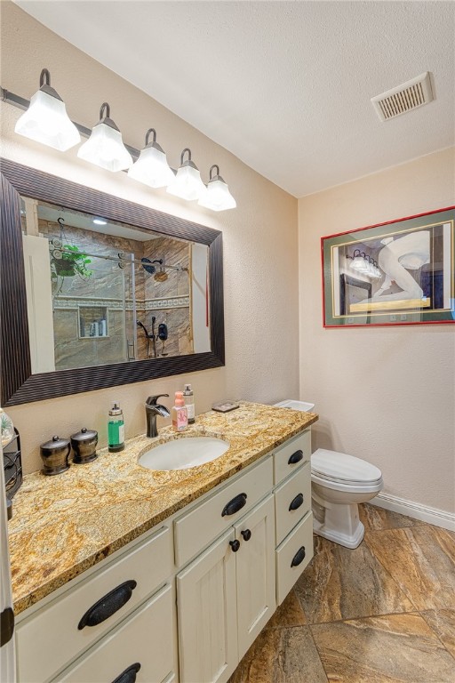 1202 Crosby Street Portland, TX 78374 - Photo 14 of 20 a bathroom with a granite countertop sink and a mirror