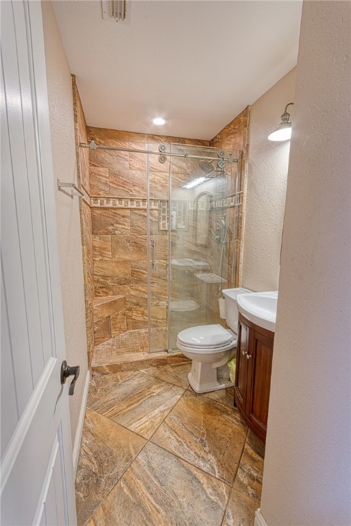 1202 Crosby Street Portland, TX 78374 - Photo 15 of 20 a bathroom with a toilet and a shower