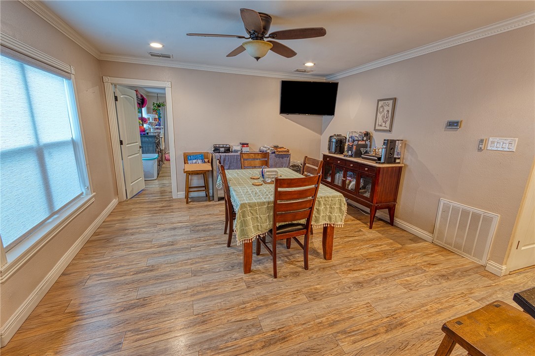 1202 Crosby Street Portland, TX 78374 - Photo 4 of 20 a view of a dining room with furniture and a chandelier