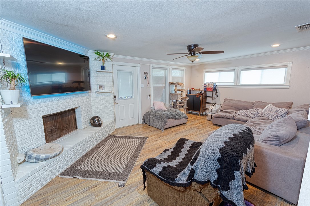 1202 Crosby Street Portland, TX 78374 - Photo 6 of 20 a living room with furniture and a flat screen tv