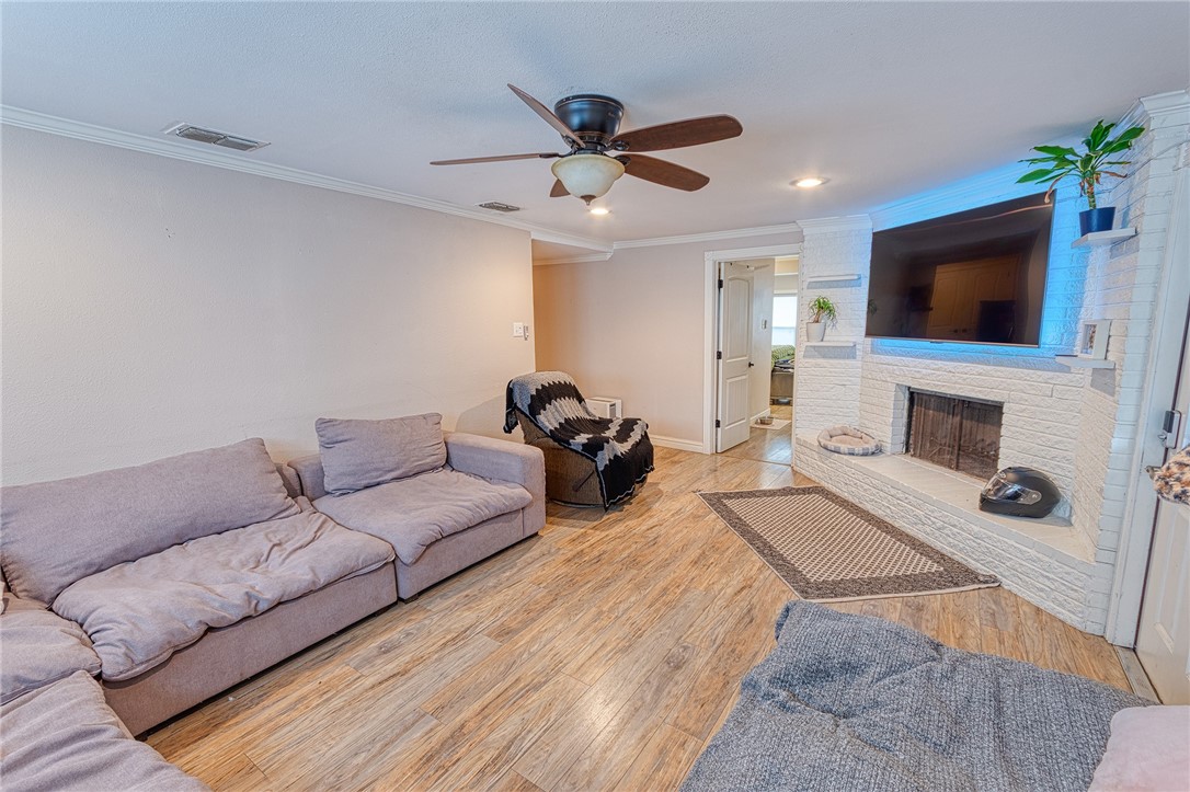 1202 Crosby Street Portland, TX 78374 - Photo 7 of 20 a living room with furniture and a flat screen tv