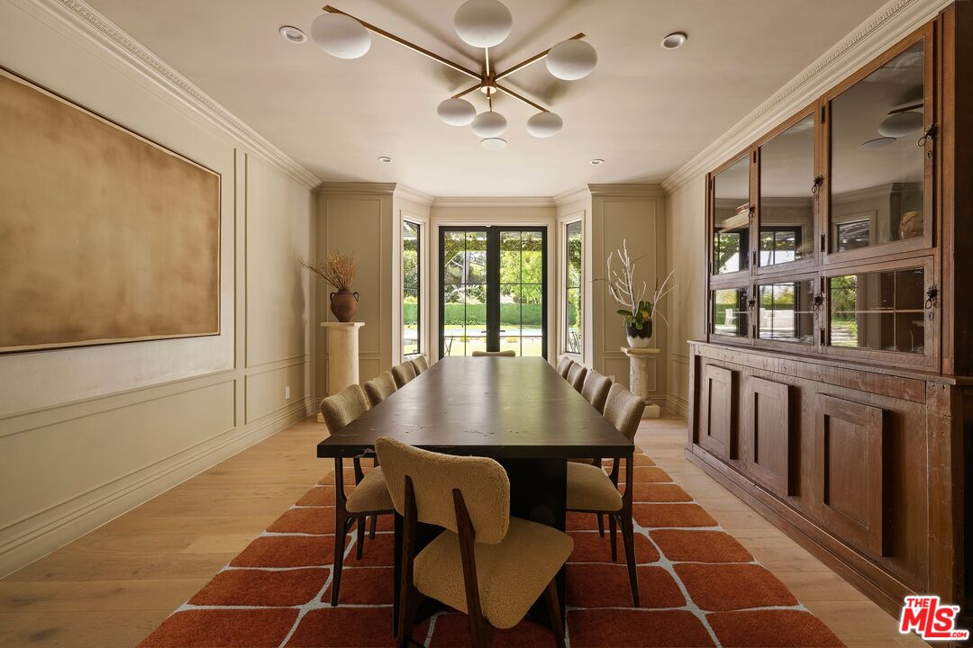 9872 Whitwell Drive Beverly Hills, CA 90210 - Photo 12 of 32 a view of a dining room with furniture and a potted plant