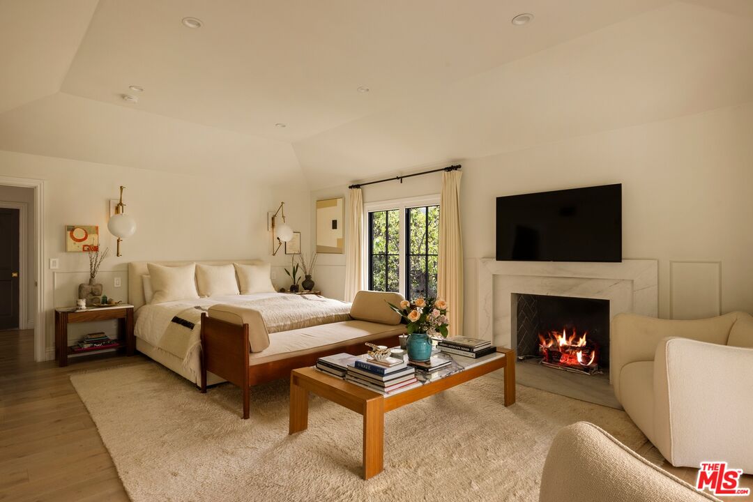 9872 Whitwell Drive Beverly Hills, CA 90210 - Photo 20 of 32 a living room with furniture fireplace and window