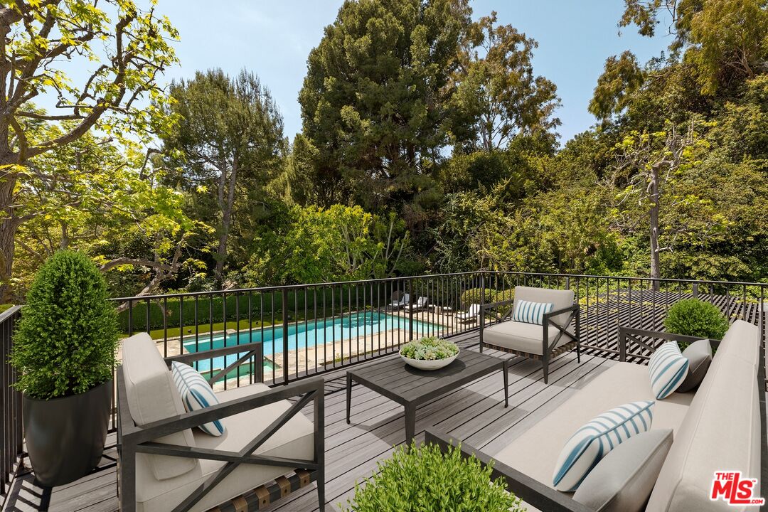 9872 Whitwell Drive Beverly Hills, CA 90210 - Photo 22 of 32 a view of a lake with furniture