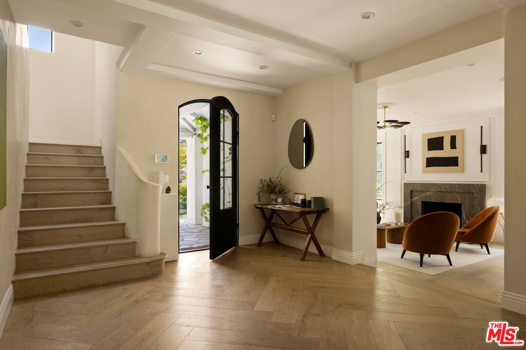 9872 Whitwell Drive Beverly Hills, CA 90210 - Photo 3 of 32 a view of living room with furniture and a fireplace