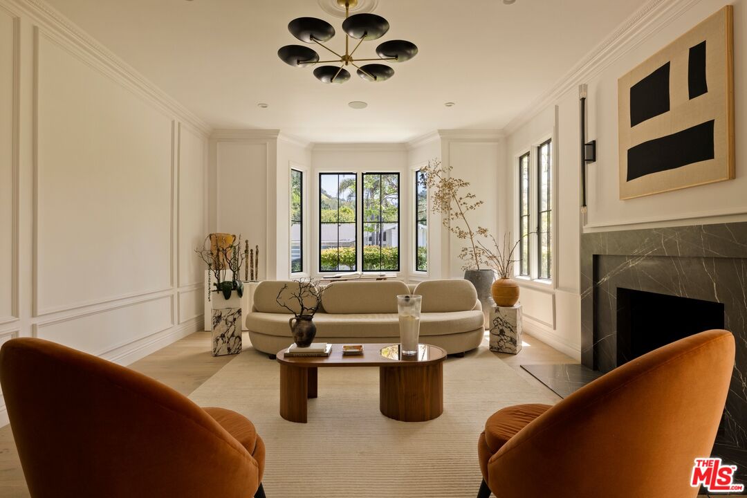9872 Whitwell Drive Beverly Hills, CA 90210 - Photo 4 of 32 a living room with furniture fireplace and flat screen tv