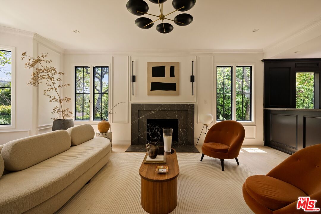 9872 Whitwell Drive Beverly Hills, CA 90210 - Photo 5 of 32 a living room with furniture and a fireplace
