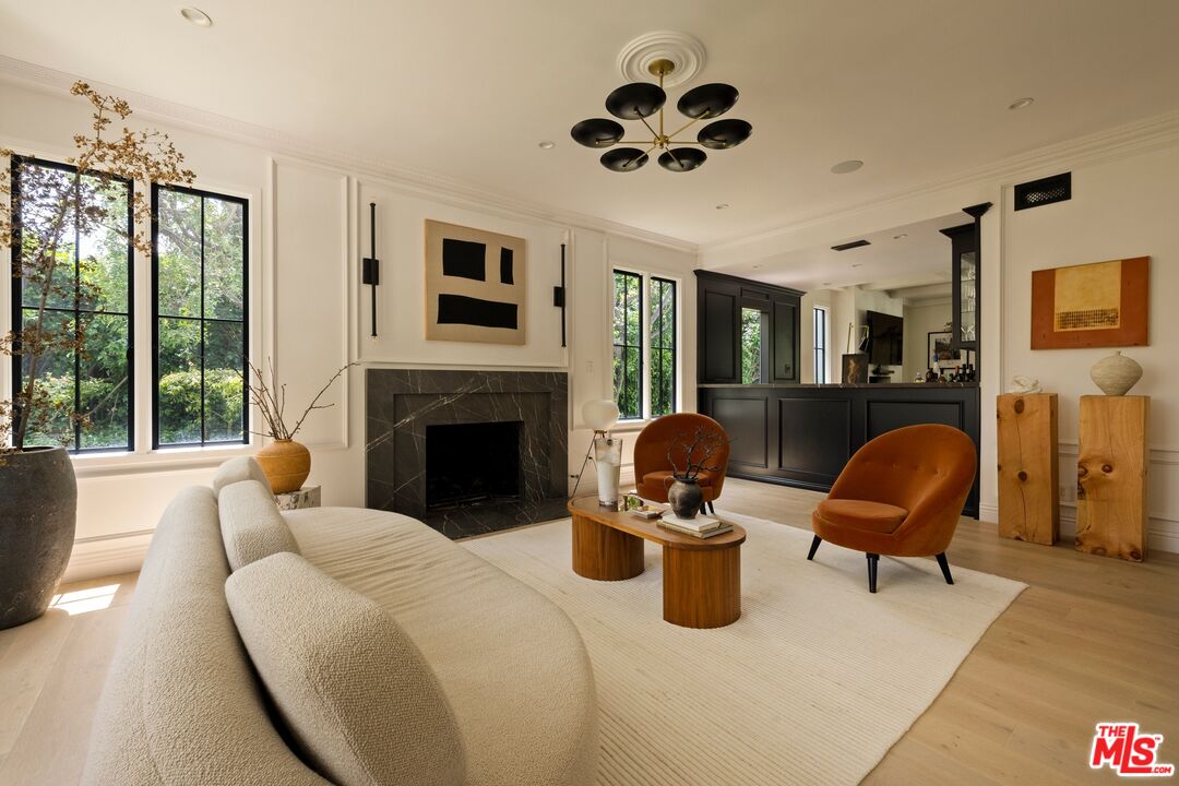 9872 Whitwell Drive Beverly Hills, CA 90210 - Photo 6 of 32 a living room with furniture and a fireplace