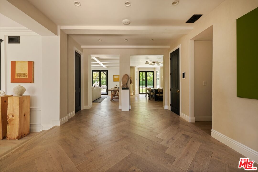 9872 Whitwell Drive Beverly Hills, CA 90210 - Photo 7 of 32 a view of a living room with a hallway