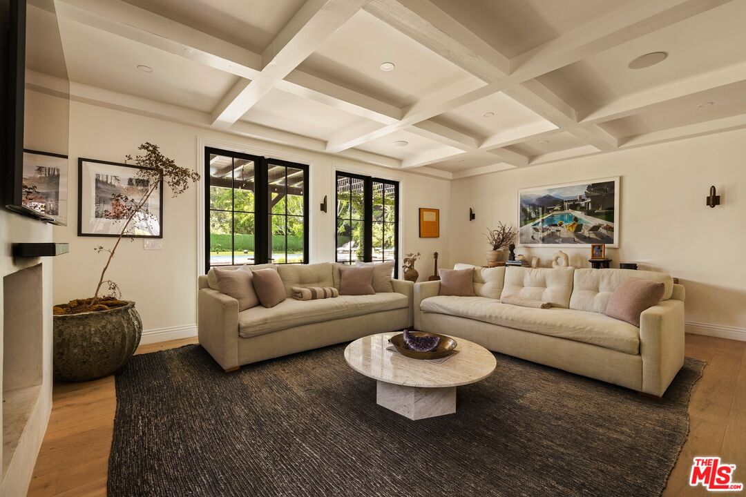 9872 Whitwell Drive Beverly Hills, CA 90210 - Photo 8 of 32 a living room with furniture and a large window