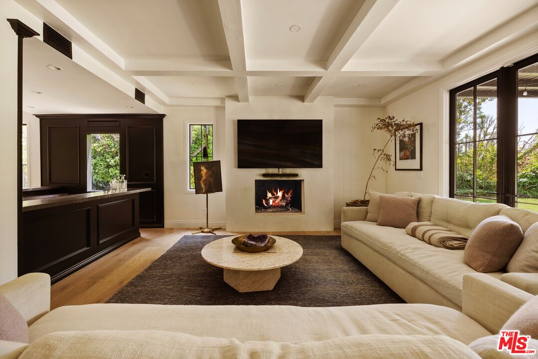 9872 Whitwell Drive Beverly Hills, CA 90210 - Photo 9 of 32 a living room with furniture and a flat screen tv