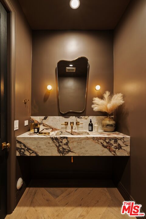 9872 Whitwell Drive Beverly Hills, CA 90210 - Photo 10 of 32 a bathroom with a sink and a mirror