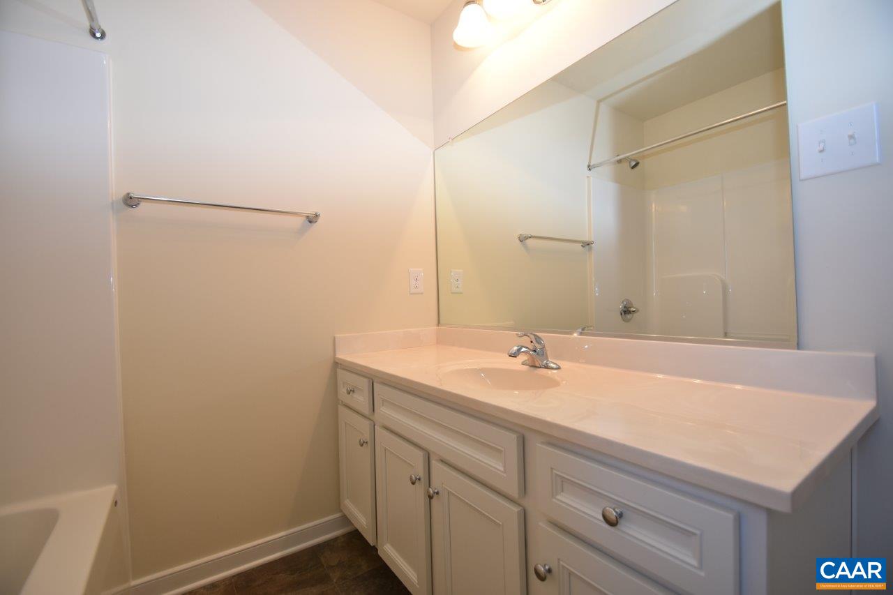 87 Riva Way Palmyra, VA 22963 - Photo 16 of 19 a bathroom with a sink and a mirror