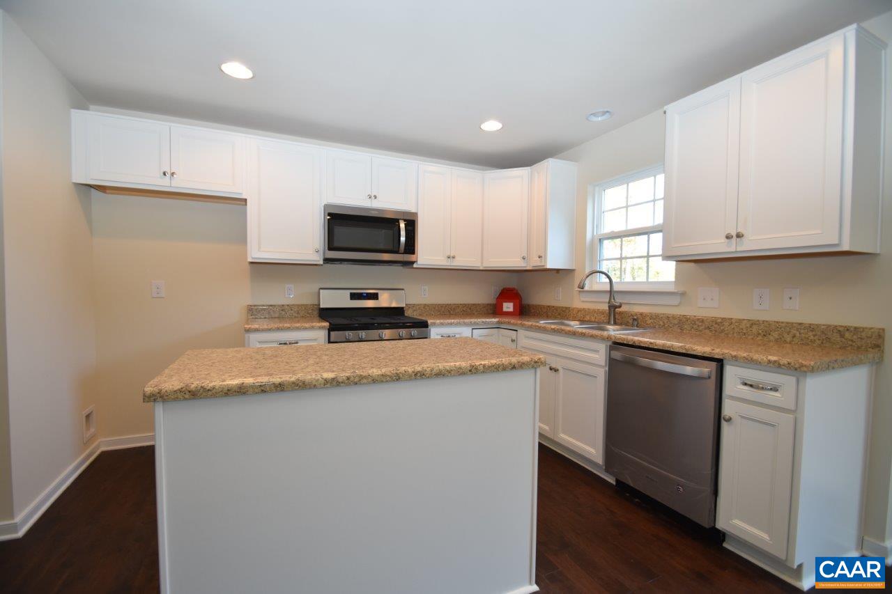 87 Riva Way Palmyra, VA 22963 - Photo 3 of 19 a kitchen with granite countertop a sink a counter top space and cabinets