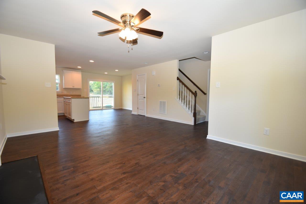 87 Riva Way Palmyra, VA 22963 - Photo 8 of 19 wooden floor in an empty room with a kitchen