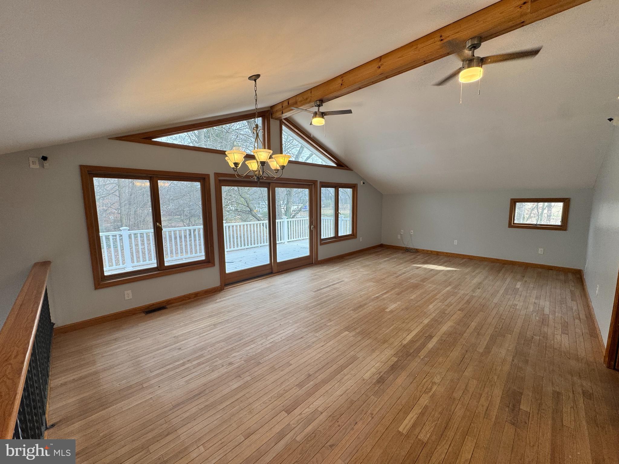 2427 Grubb Road Wilmington, DE 19810 - Photo 12 of 32 a view of an empty room with a window and wooden floor