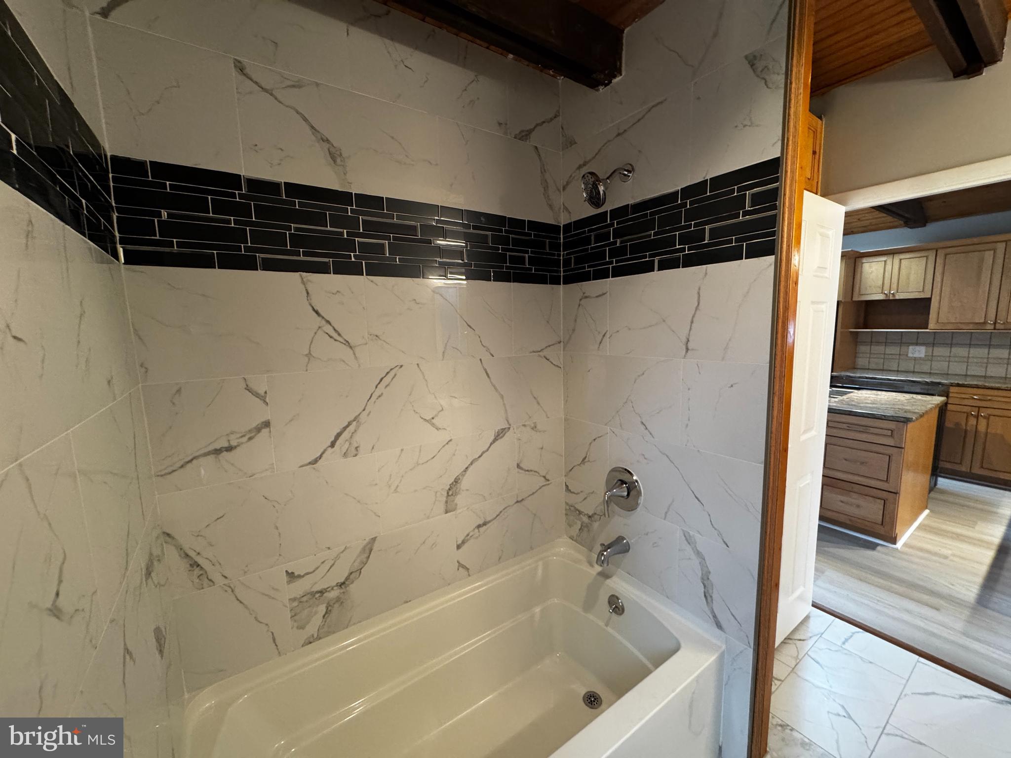 2427 Grubb Road Wilmington, DE 19810 - Photo 26 of 32 a bathroom with a shower and a tub