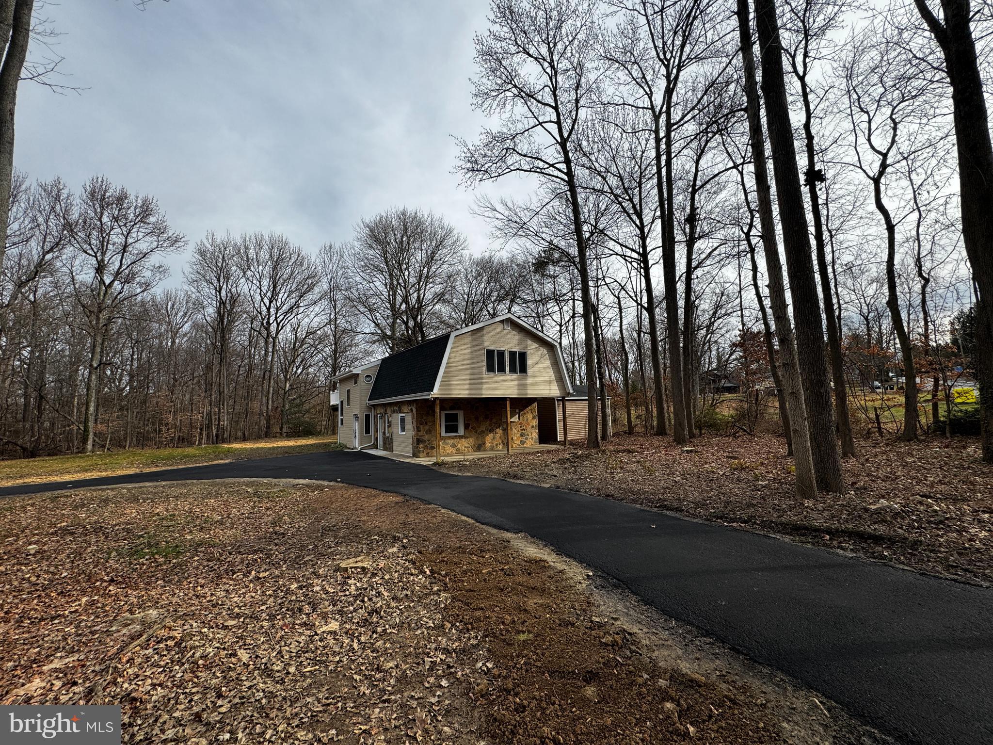 2427 Grubb Road Wilmington, DE 19810 - Photo 32 of 32 a big house with large trees and wooden fence